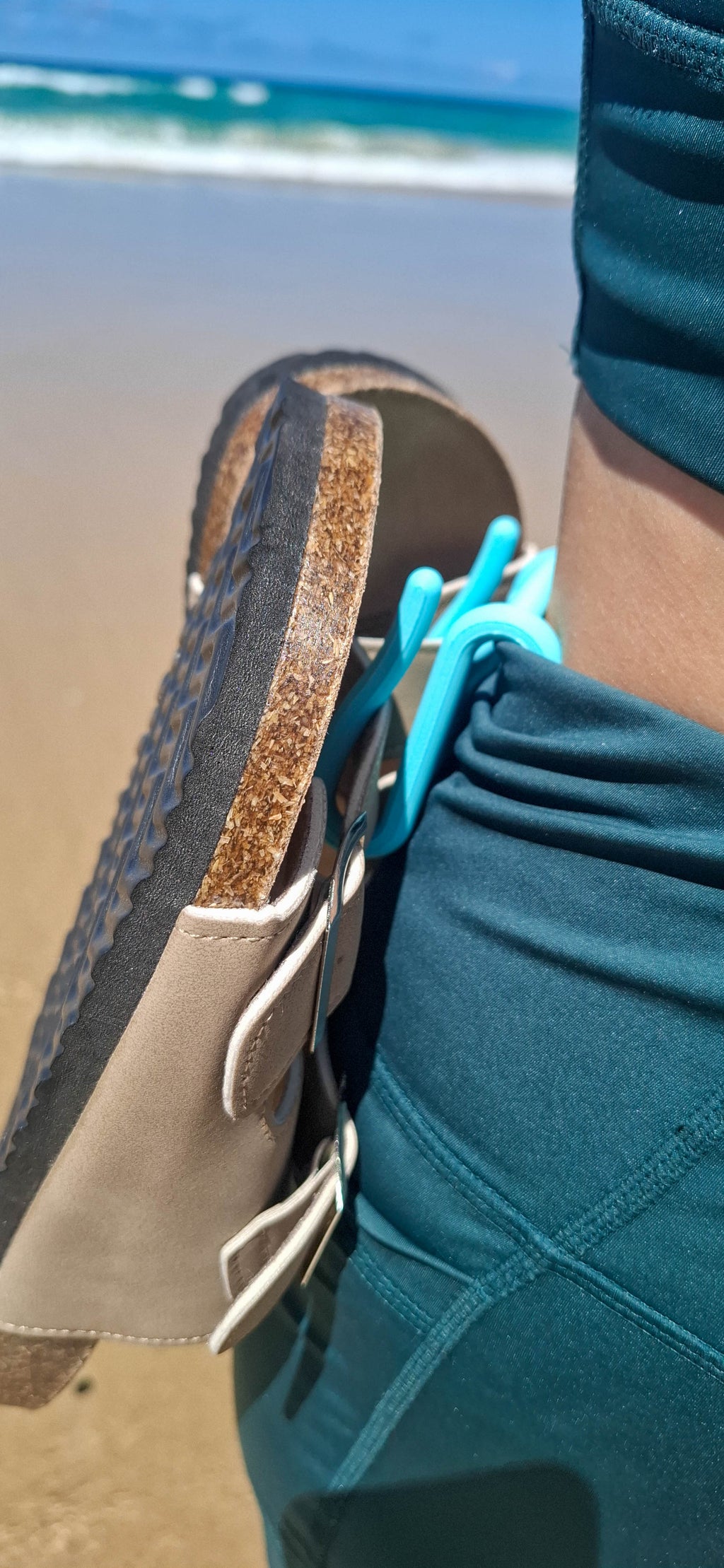 The Sandal Handle™ hands-free sandal carrier in Light Blue